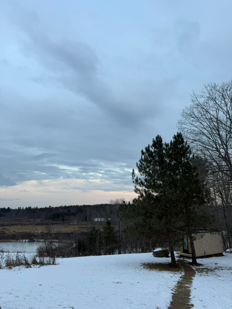 Searsmont, Maine custom sauna — snowy path past the sauna toward the field and pond below
