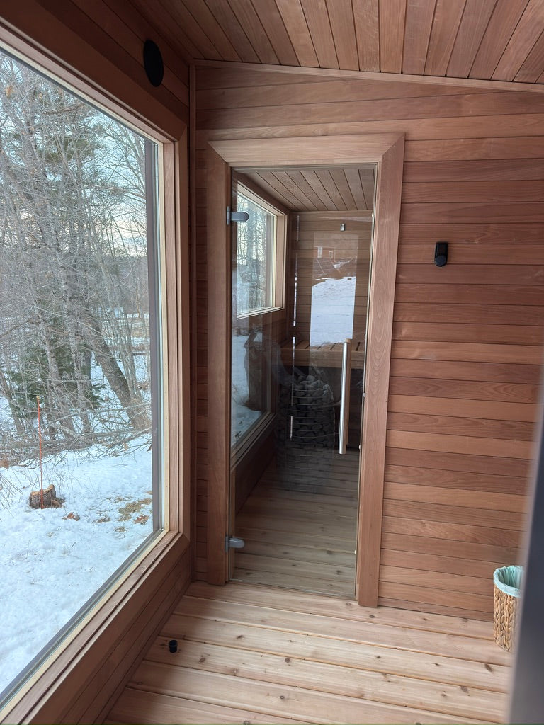 Searsmont, Maine custom sauna — yoga and changing room with a full-height window, looking through to the hot room