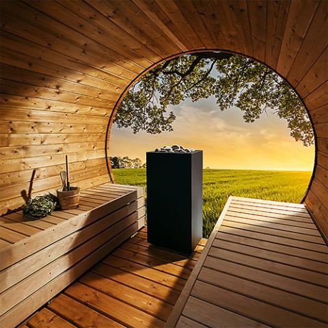 HUUM CORE black steel sauna heater installed in a sauna