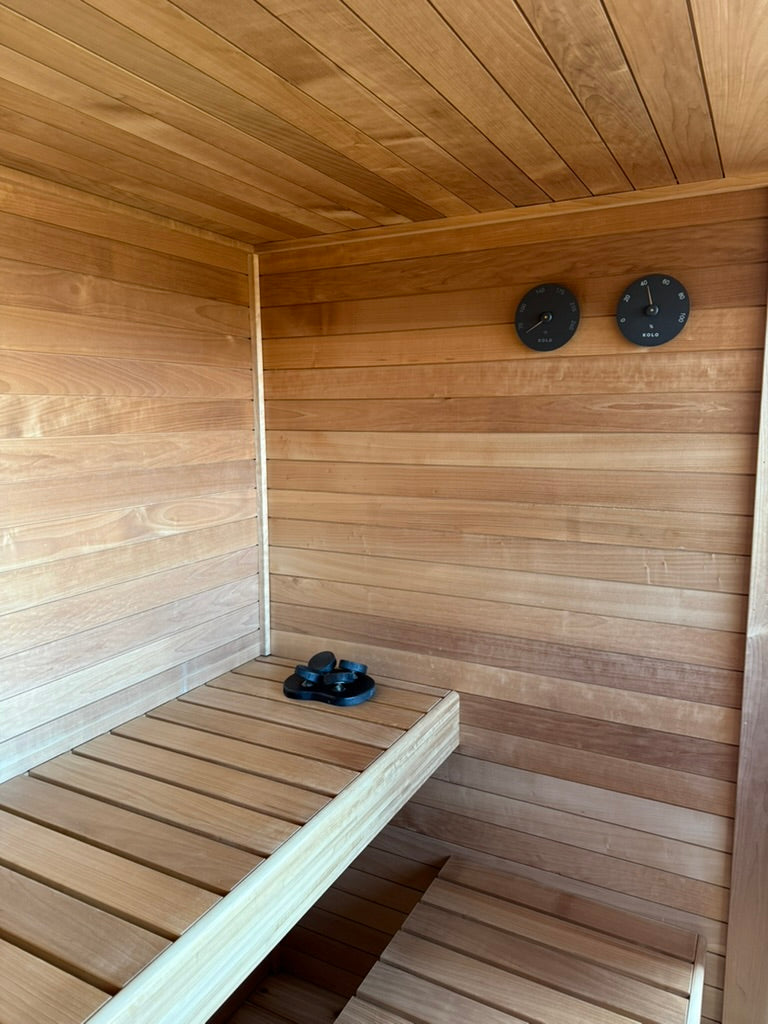 Searsmont, Maine custom sauna — bench corner eased in a curve, thermometer and hygrometer on the wall