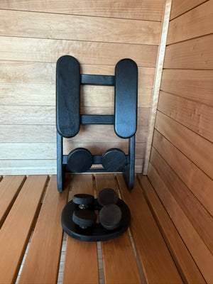 Searsmont, Maine custom sauna — black sauna bucket, ladle and headrests against the thermo-aspen wall
